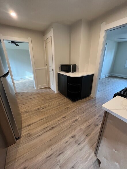 Kitchen includes newly installed cabinets, counters, and appliances - 1382 E 43rd St