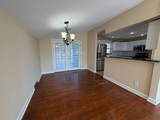 Building Photo - Freshly Painted Split-Level Home with Large Deck & Lawn Care Included