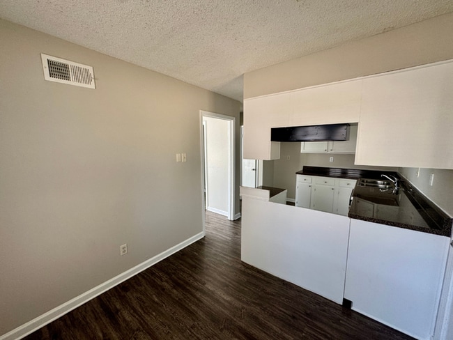 Building Photo - Charming 3BR/2BA Near Southwind | Soaring Vaulted Ceilings, Brick Fireplace & Fenced Yard