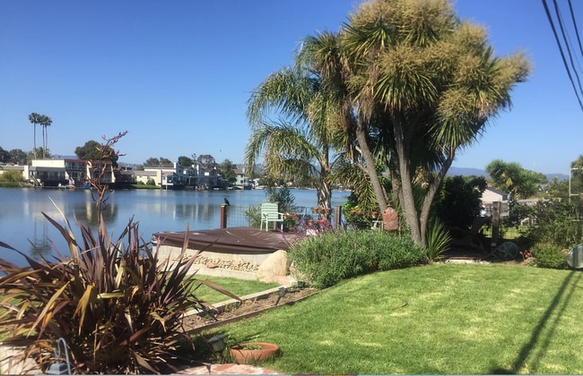 Building Photo - Rare prime waterfront home right on the San Mateo Lagoon, available August 15th!