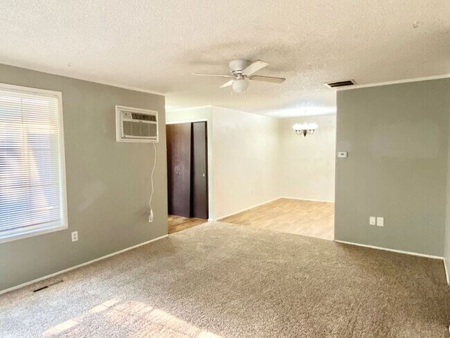 Building Photo - Spacious 3 Bedroom 1 Bath Duplex in South Loveland with Huge Fenced Backyard & 2-Car Garage!