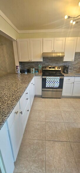 Kitchen offers fridge stove dishwasher and microwave - 8740 Lueck Ln