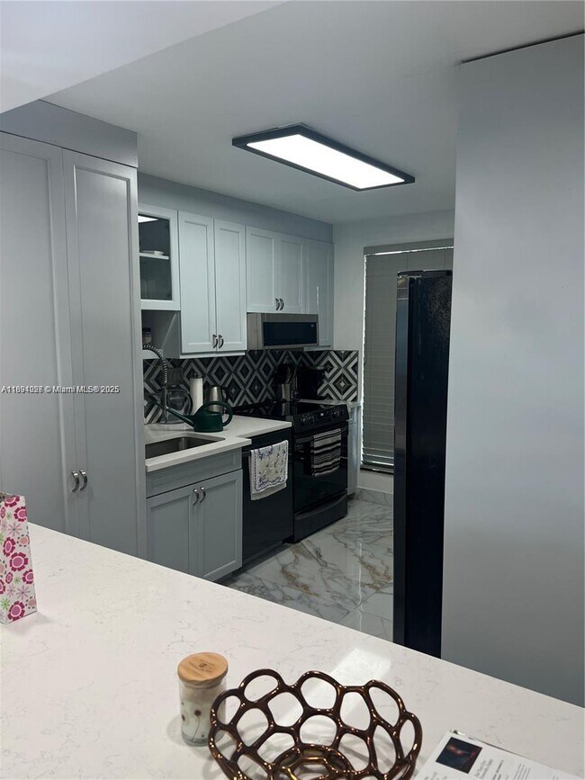 Building Photo - 10240 Collins Ave