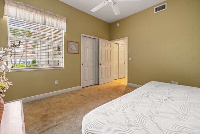 Building Photo - Experience Bell Tower Park. GATED ground floor 2 Bed 2 Bath Den 1 Car Garage Condo.