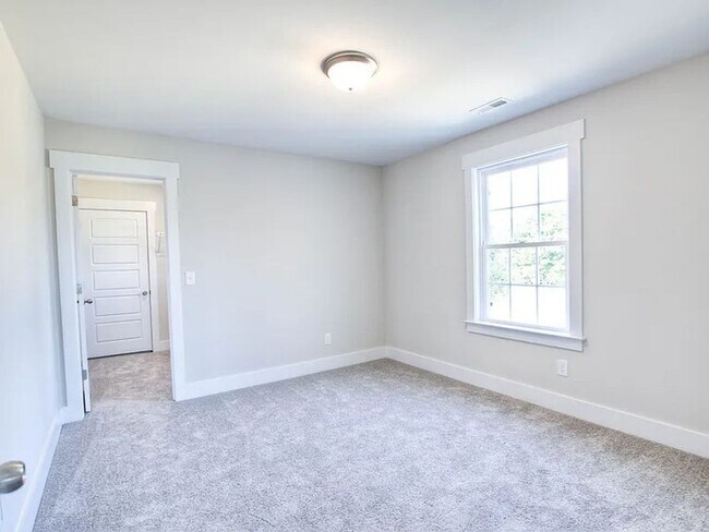 Building Photo - Situated on over 3 acres right in a growin...