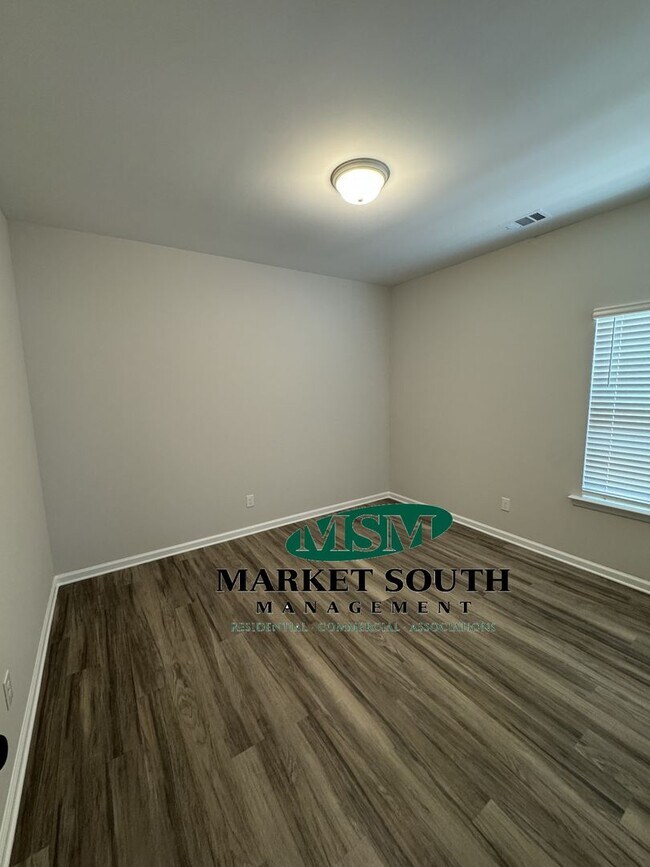 Building Photo - NEW CONSTRUCTION WITH PRIVACY FENCED YARD