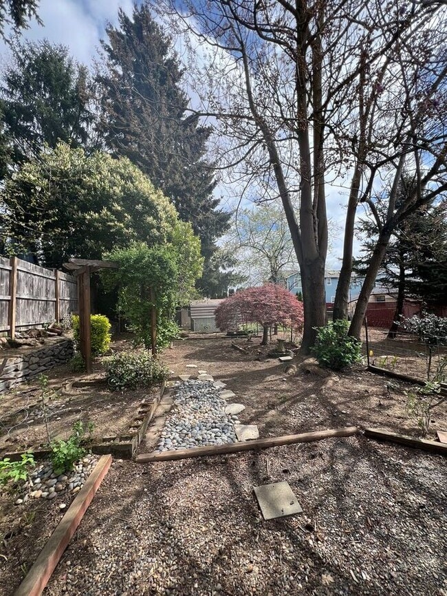 Building Photo - Professional Photos Coming Soon | Your Mt. Tabor Oasis: Huge Yard, Oversized Shop-Garage & Sun-Dr...