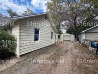 Building Photo - $999 - 4 bed 2 bath - Single Family Home