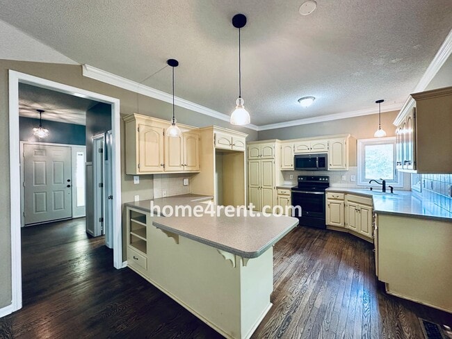 Building Photo - Blue Valley Schools w/ Wood Floors, Finished Basement and a Peaceful, Private Fenced Yard!