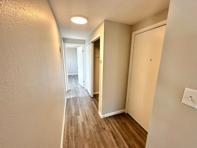 Step into sophistication with this elegant and welcoming hallway. - Allison West Apartments