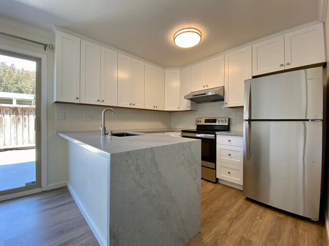 Building Photo - Newly Renovated Condo with NEW KITCHEN! - ...