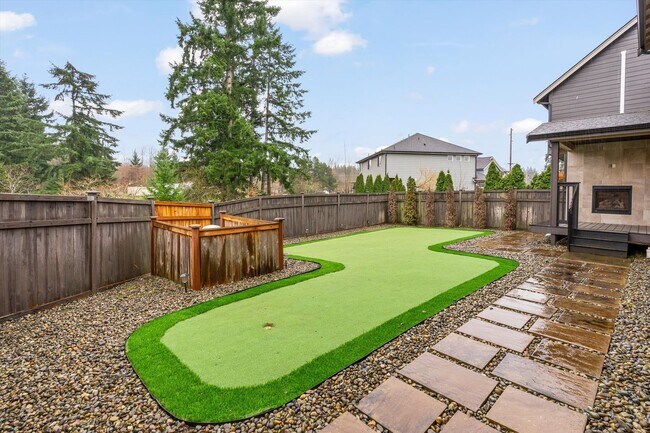 Building Photo - Backyard Putting Green + Outdoor Fireplace | Comfortable Puyallup Rental