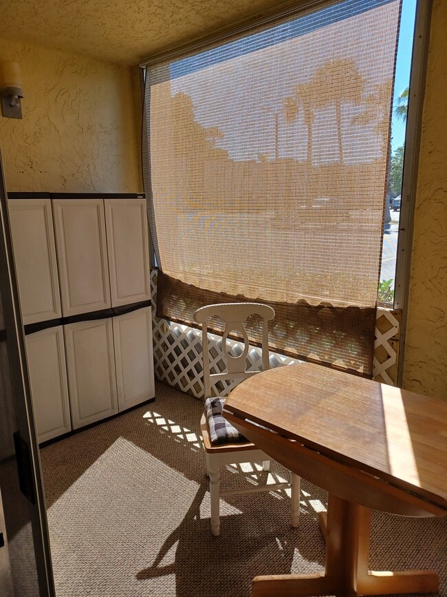 Enclosed front porch with storage - 7701 Starkey Rd