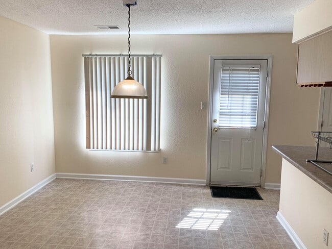 Eat in kitchen and back door to private gated yard with storage shed - 7985 Marsha Woods Dr