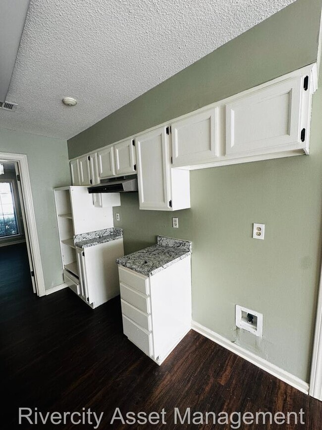 Building Photo - charming three-bedroom, two-full-bath resi...