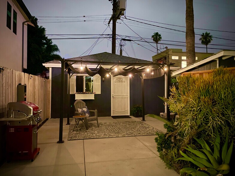 Patio lit with warm white solar LED string lights - 3541 Helms Ave
