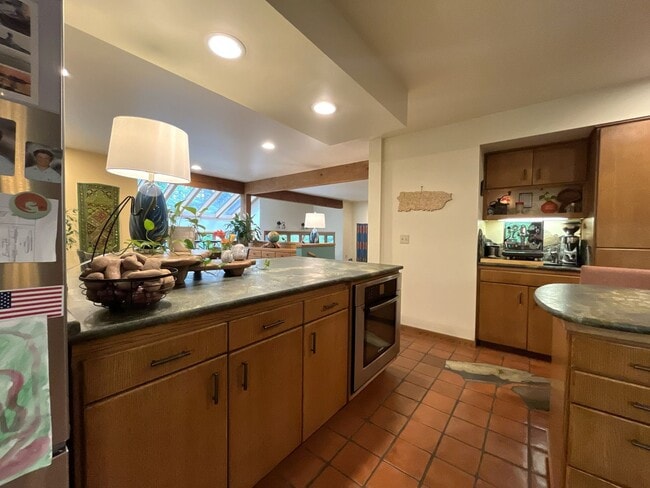 Building Photo - One-of-a-Kind Custom Home with Wall of Windows, Stone Fireplaces, Expansive Entertainment Space &...