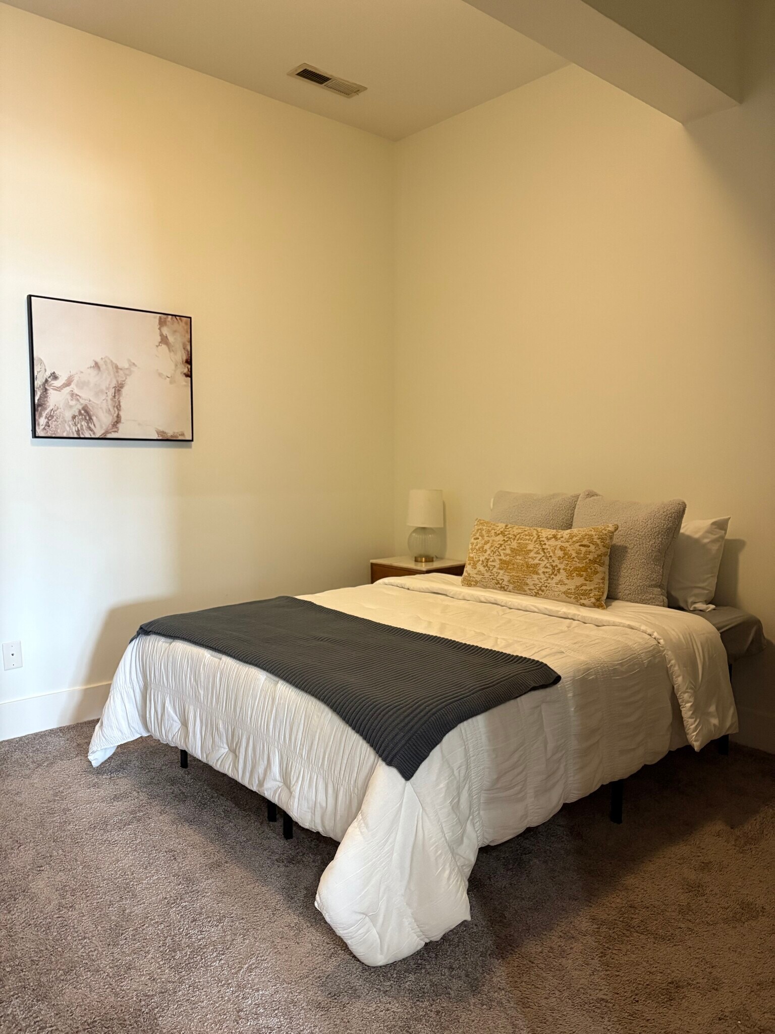 Large bedroom with ceiling fan and walk-in closet. - 233 E Saint Joseph St