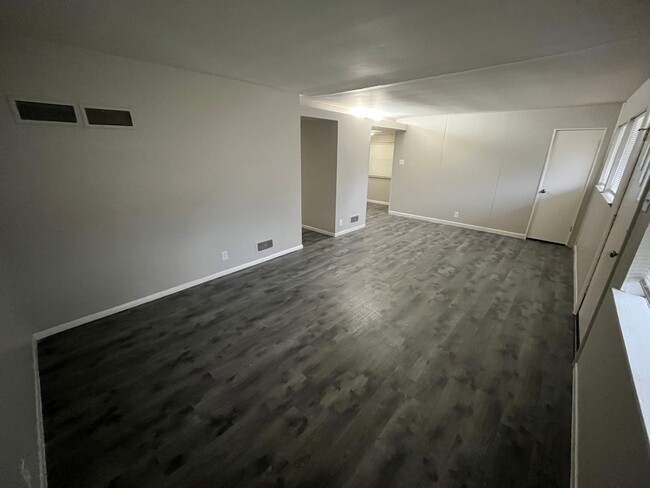 Building Photo - Newly Renovated Three Bedroom Coming Avail...