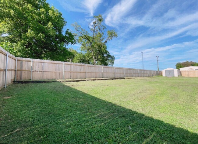 Building Photo - Fenced yard/Storage building/Close to college/Paved street