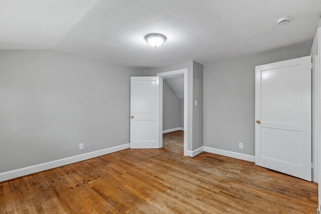 Building Photo - Brick home, Two Story, Hardwoods, DR, 2 Sun Rooms, FP, Carport!.