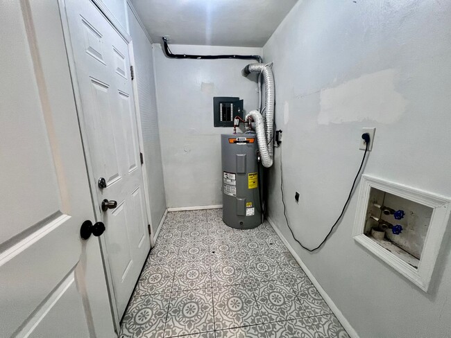 Building Photo - Three-bedroom, two-and-a-half bathrooms in...