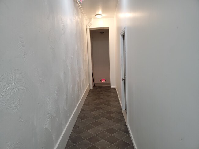 Back exit entrance - 109 N Main St