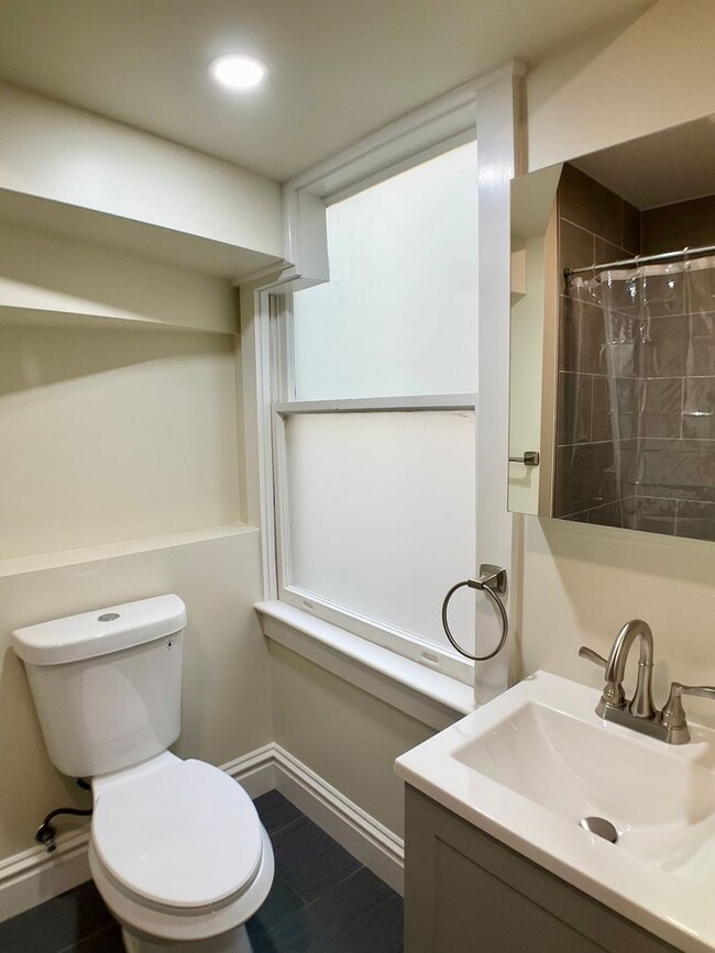 Building Photo - REMODELED 4BR/3BA. In Unit Laundry! Dishwasher! Bay Windows!