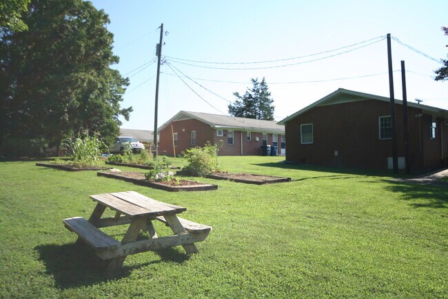 Building Photo - Private carport, in-unit laundry, and the Lakewood strip right outside your door.