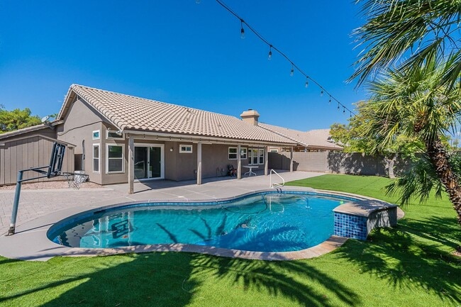 Primary Photo - Charming 4-Bedroom Home with Luxurious Poo...