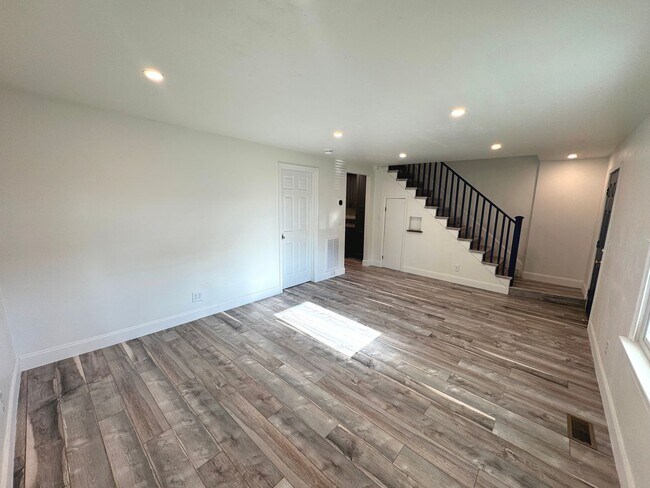 Building Photo - RENOVATED 3 bedroom end unit across the street from the Beach!