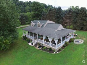 Building Photo - 5 Bedroom 2 1/2 Bath Home w/ Wrap Around P...