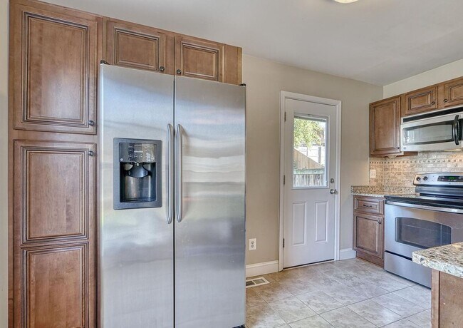 Building Photo - Updated End-of-Group Townhome with Finished Lower Level, Fenced Yard & Community Pool