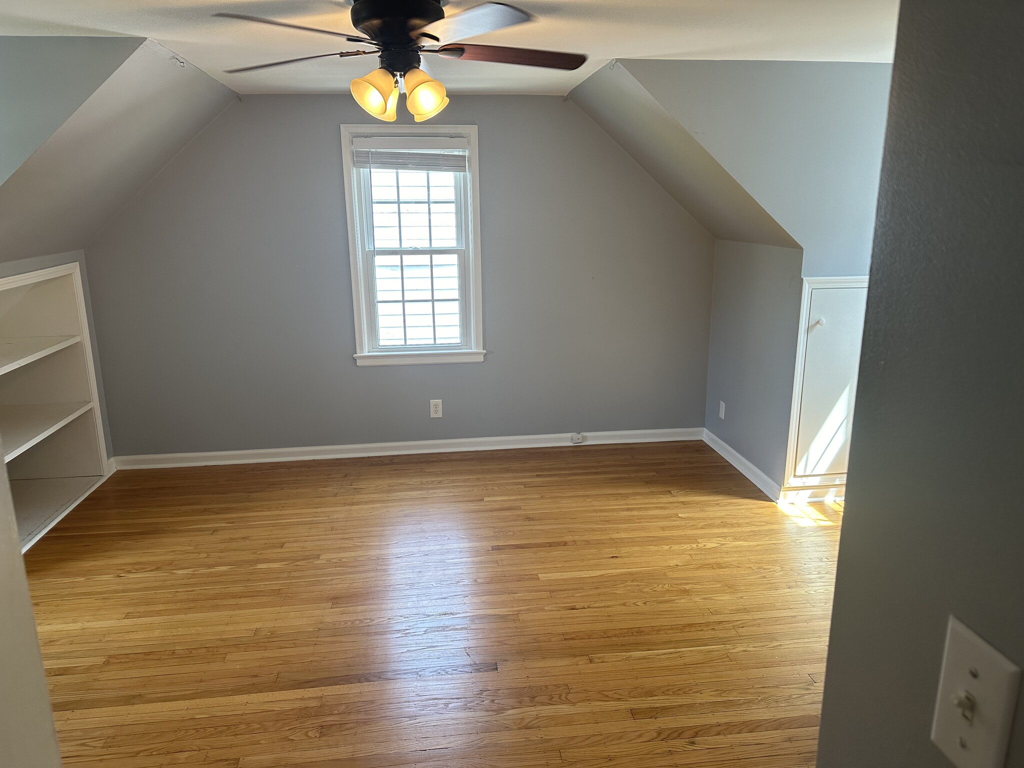 Second bedroom upstairs with windows on three sides. - 5101 Boulevard Pl