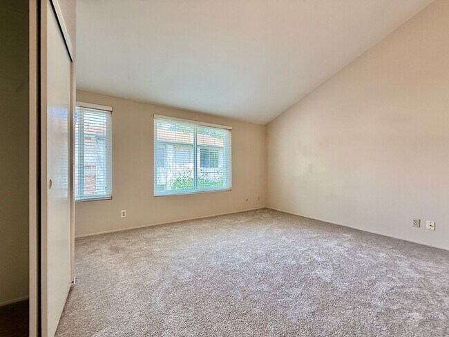 Building Photo - Move in Ready! 2BD Townhome! New Carpet! Two Patio Spaces! Attached Garage!