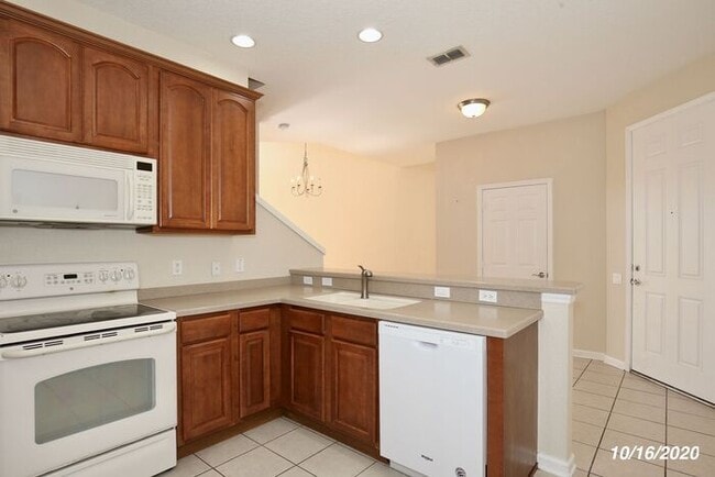 Building Photo - Beautiful 3/3.5 Townhome with a Spacious 2 Car Garage in the Gate Guarded Community of Spring Isl...