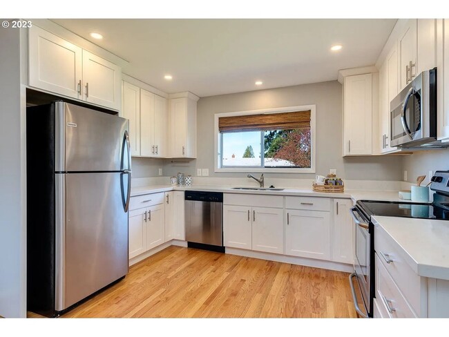 Building Photo - Stylishly Updated Mid-Century Gem on a Qui...