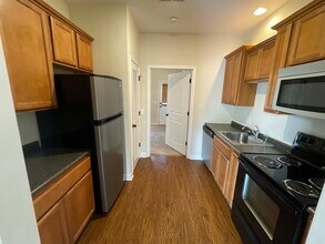 Building Photo - Old Main Condos 1BR | walking distance to Cotton District | Fall ‘26 AVAILABILITY