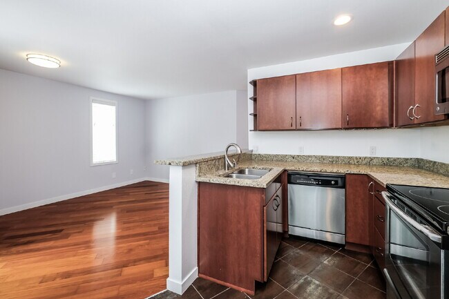 Building Photo - **Updated 2-Bedroom Condo with Secure Parking**