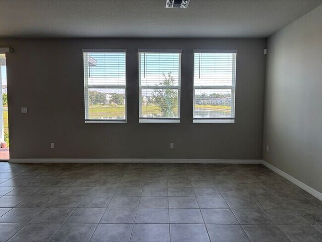 Building Photo - Like-New 4 Bedroom 3 Bath with Pond View & Two Living Spaces — Minutes to South Lake Nona