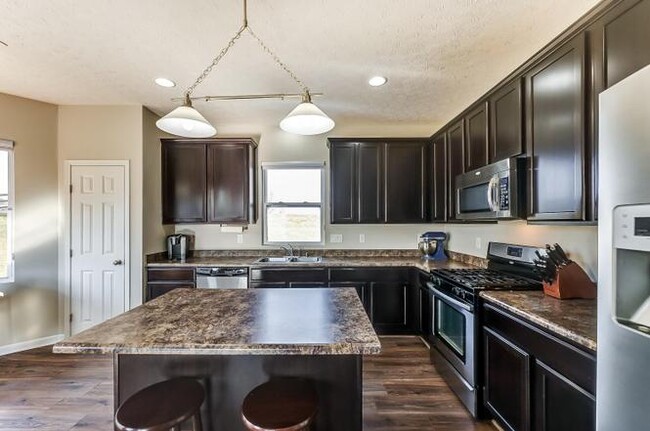 Building Photo - 6995 Hearthwood Dr