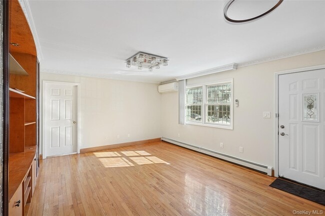 Building Photo - 214-27 38th Ave