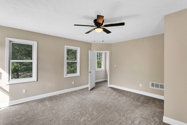 Continuation of the primary bedroom with closet access shown - 2416 Magee Road Ext