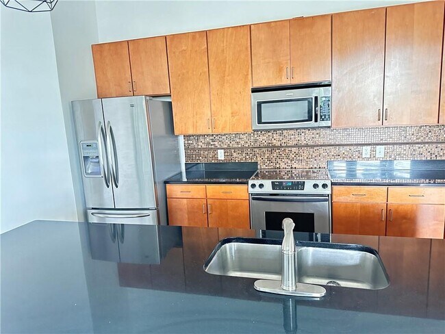 Building Photo - 711 Cosmopolitan Dr NE