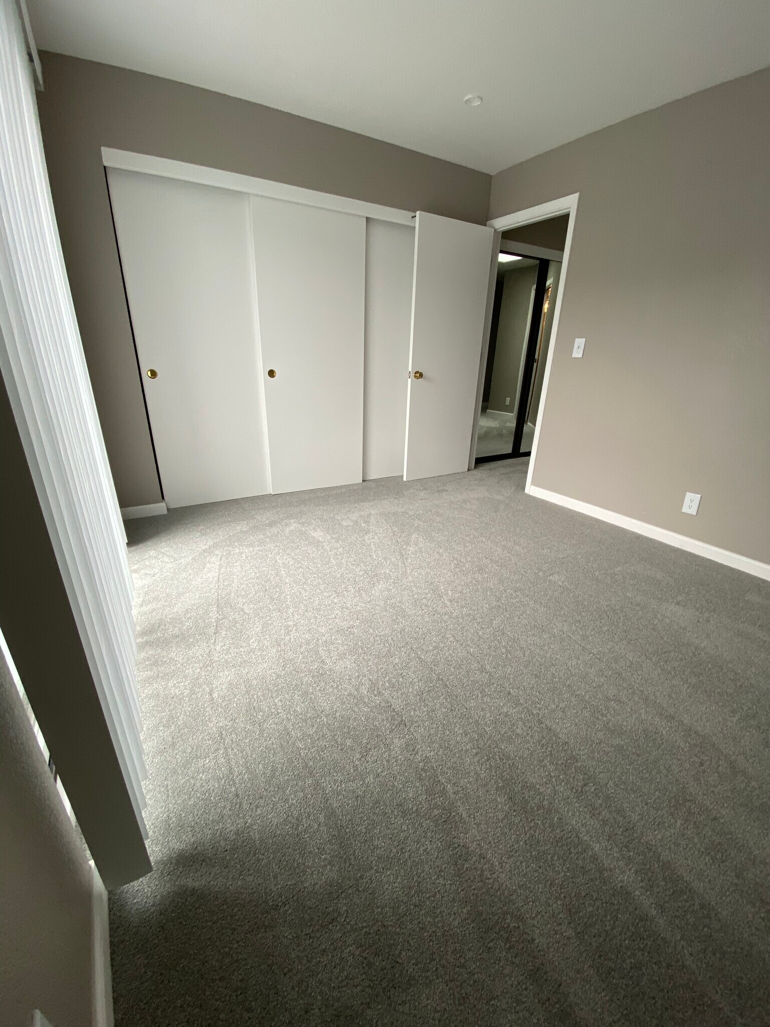 Another angle of top west facing bedroom showing closet and entry door - 443 Willow Ave
