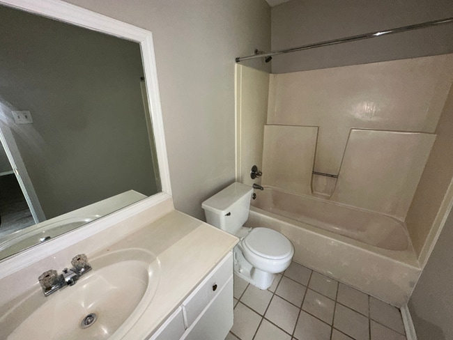 Building Photo - Charming 3BR/2BA Near Southwind | Soaring Vaulted Ceilings, Rustic Fireplace & Garage