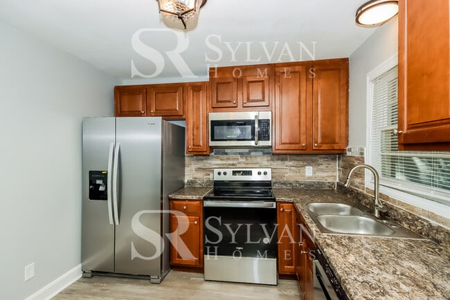 Building Photo - Lease today! No extra charge for contentme...