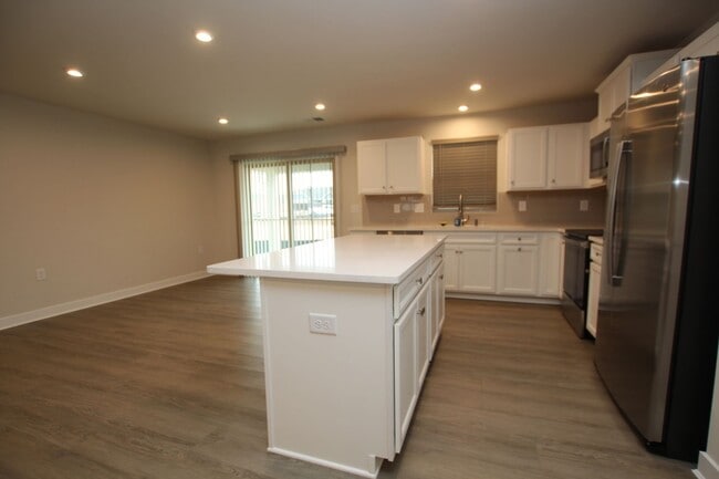 Building Photo - Maintenance Free Living in this Brand New ...