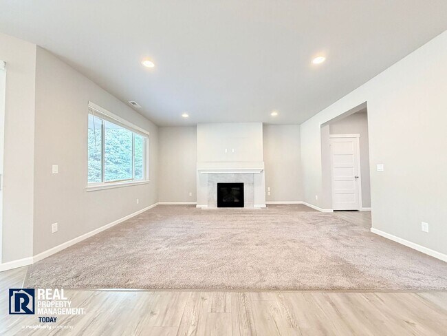 Building Photo - Easy JBLM Commute Like-New 4BR Home with 3-Car Garage & Bonus Office