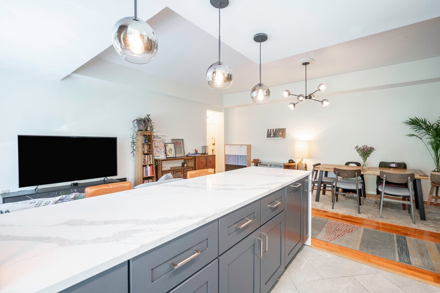 Waterfall Island table with updated cabinets - 4100 W St NW